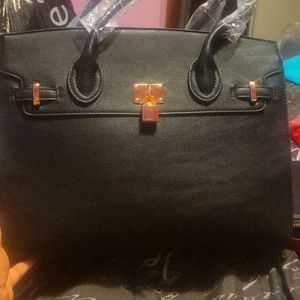 Large black bag with watching wallet